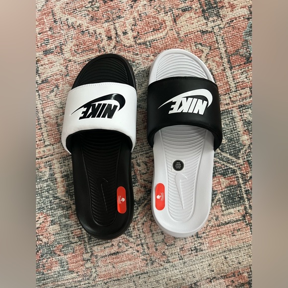 black and white mismatch nike slides